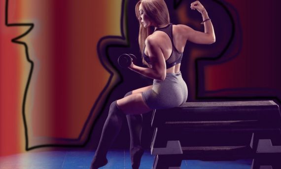 Fit woman lifting weights, showcasing strength in a gym environment.